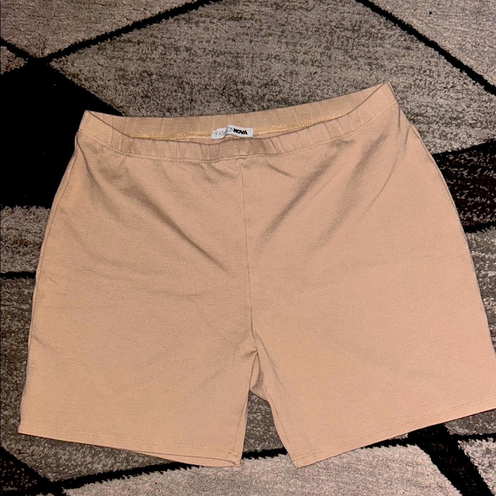 Tan biker shorts from Fashion Nova. 
Size large im 5,9 and there finger length.